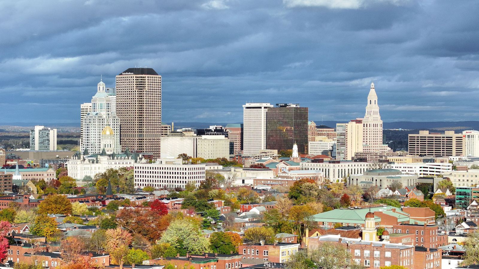 Hartford, Connecticut skyline above neighborhoods in autumn